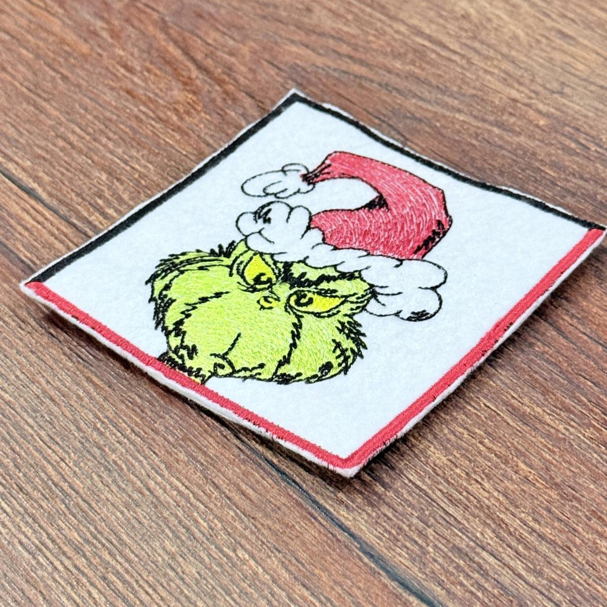 Grumpy-Christmas-Thief-Coaster-Embroidery-Design