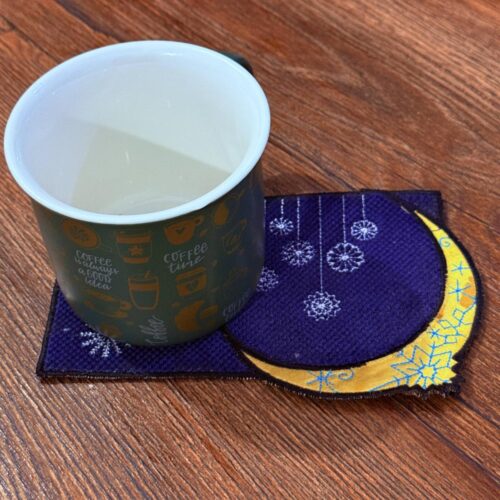 hanging-snowflakes-with-crescent-moon-mug-rug-embroidery-design