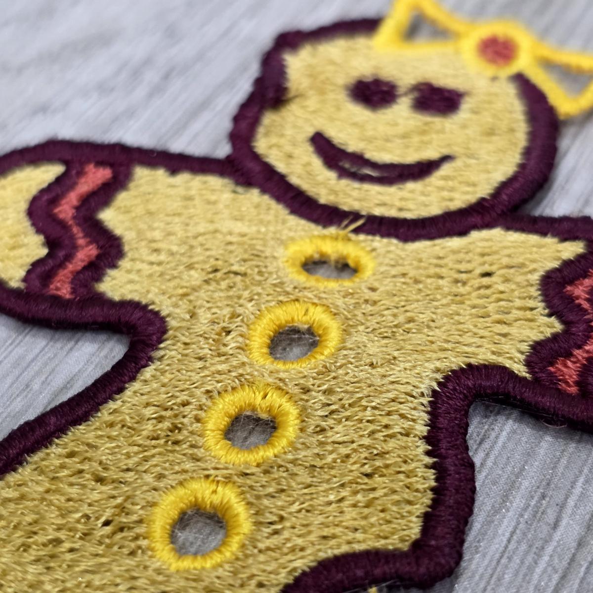 bitten-gingerbread-girl-with-bow-embroidery-design