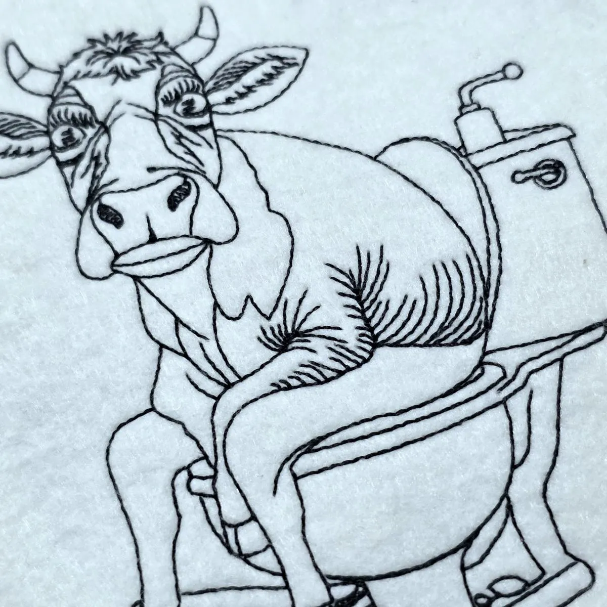 cow-caught-on-toilet-line-art-embroidery-design