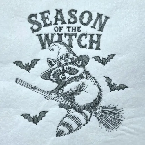 spooky-raccoon-on-a-broom