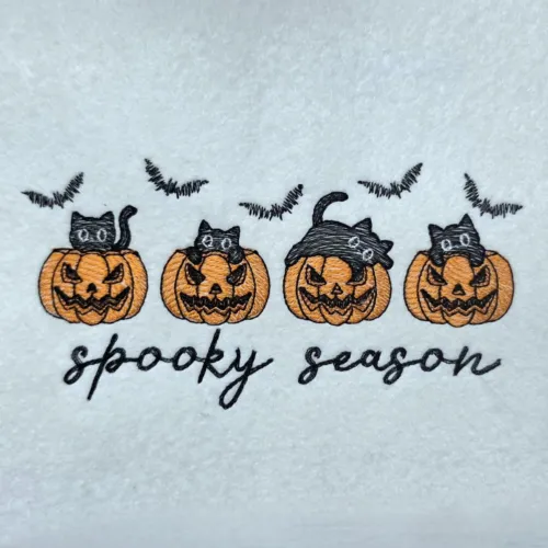 spooky-season-black-cats-in-pumpkins