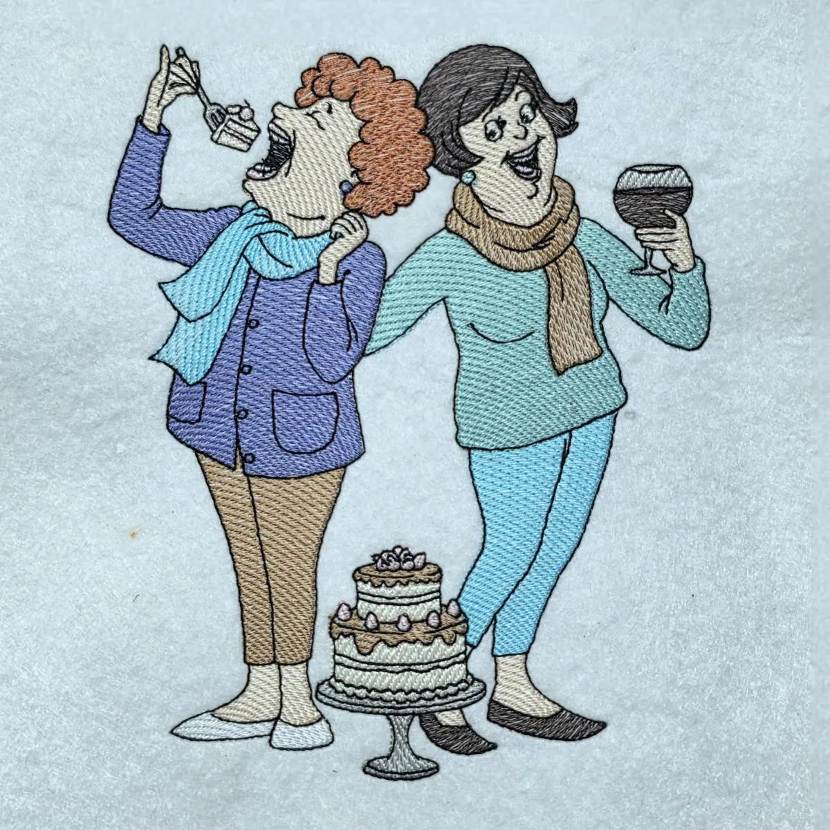 two-women-celebrating-with-cake